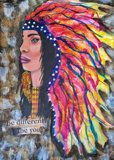 A vibrant portrait of a woman wearing a colourful headdress and traditional attire.