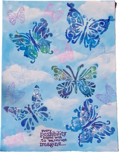 Colourful butterflies on a blue sky background with soft clouds.