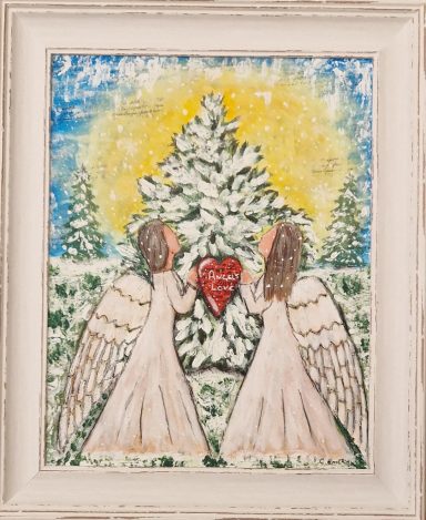 Two angels in white dresses hold a red heart in front of a snow-covered tree.