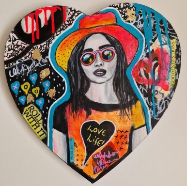 A vibrant heart-shaped artwork featuring a woman in sunglasses with a positive message.